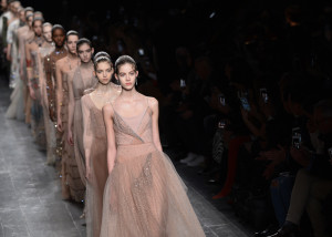 Models present creations by Valentino during the 2016-2017 fall/winter ready-to-wear collection on March 8, 2016 in Paris. AFP PHOTO / BERTRAND GUAY / AFP / Bertrand GUAY        (Photo credit should read BERTRAND GUAY/AFP/Getty Images)